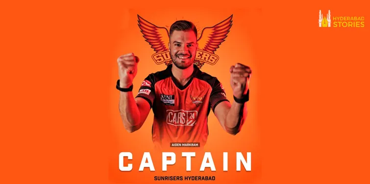 Graphic of a cricketer in team kit with raised fists on an orange background