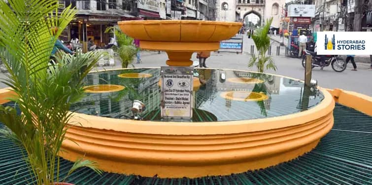 Ornamental stone fountain on a street traffic island