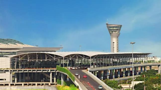 Modern airport terminal with a control tower and access road
