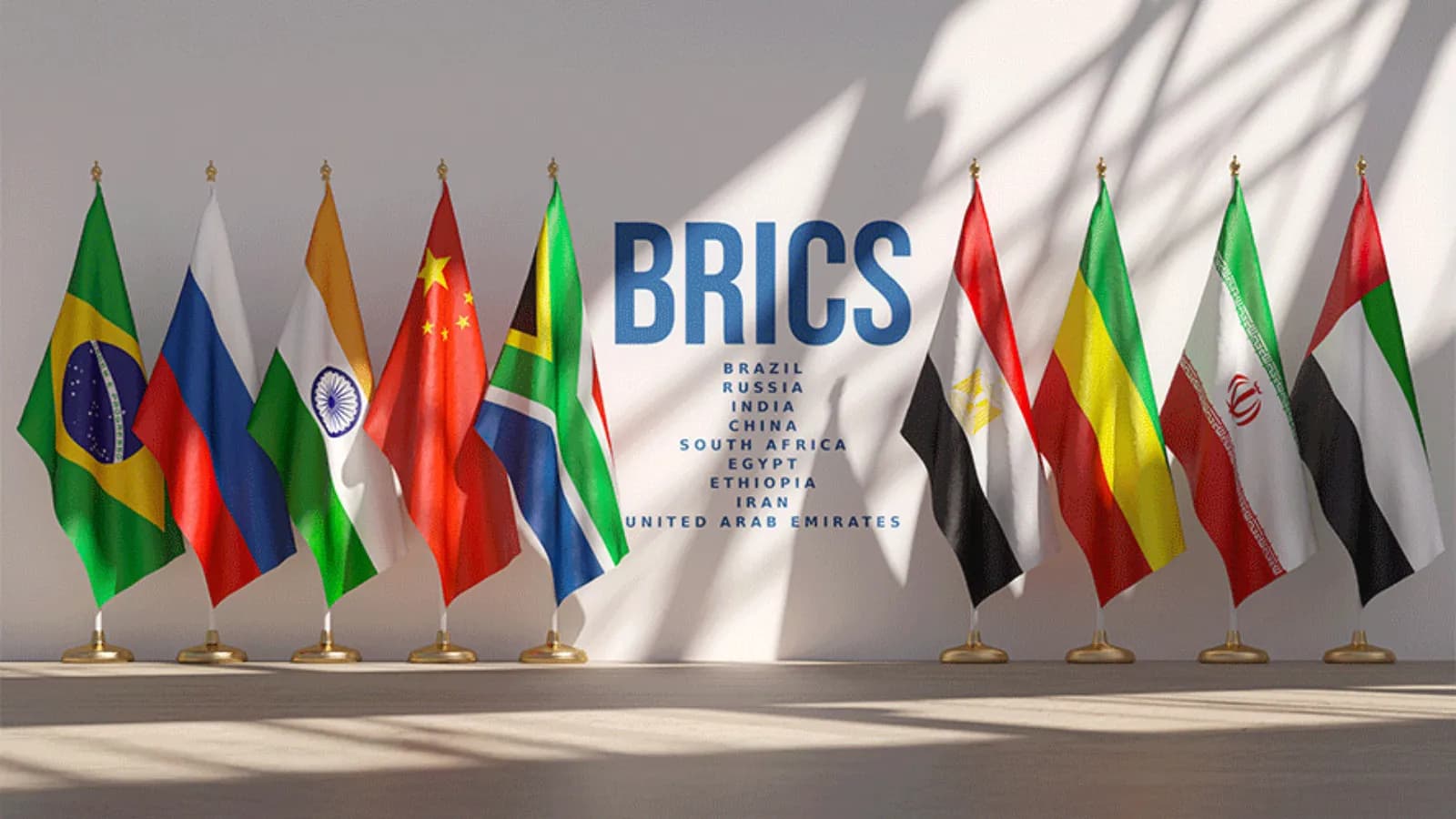 Row of national flags on stands beside a summit name