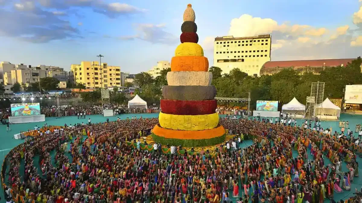 Aerial view of a tall tiered floral display before a large crowd