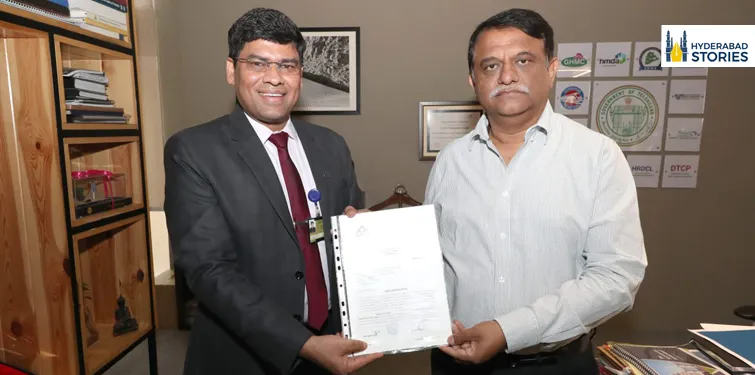 News graphic of two men holding a document indoors