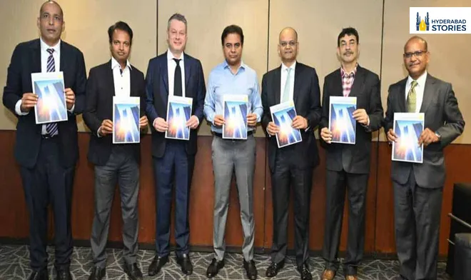 Row of men holding printed reports in a meeting room