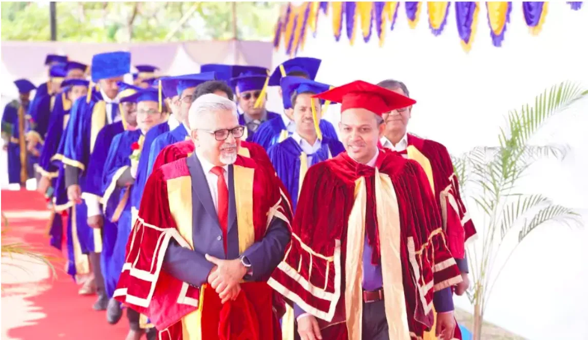 Academic procession in robes and mortarboards