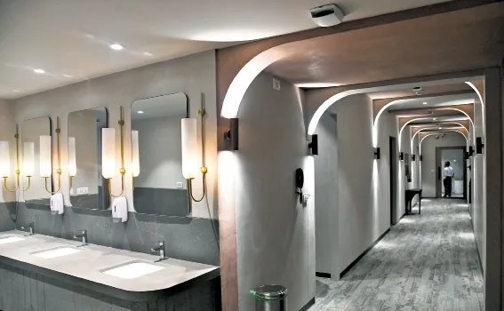 Washroom and corridor interior with arched lighting