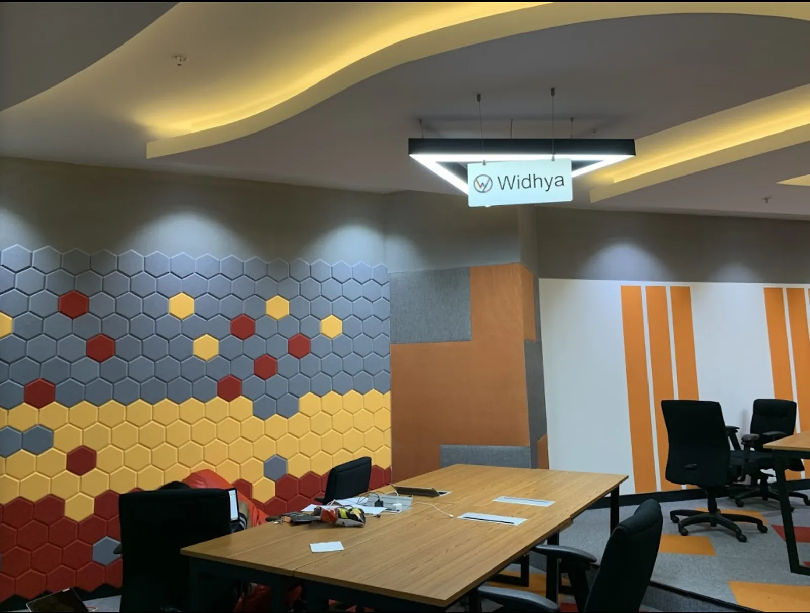 Modern office meeting room with a patterned wall and table