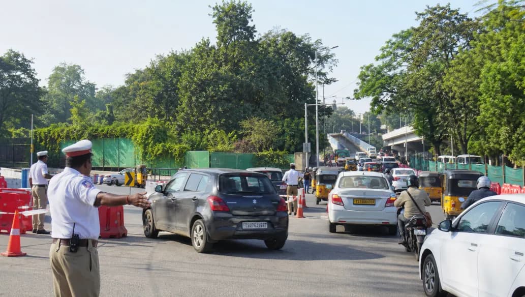 Traffic officer directing cars on a road