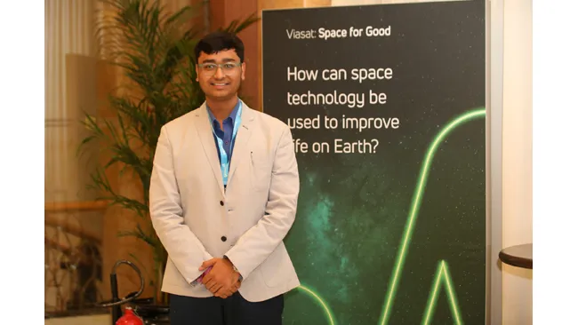 Man standing before a presentation screen at a conference