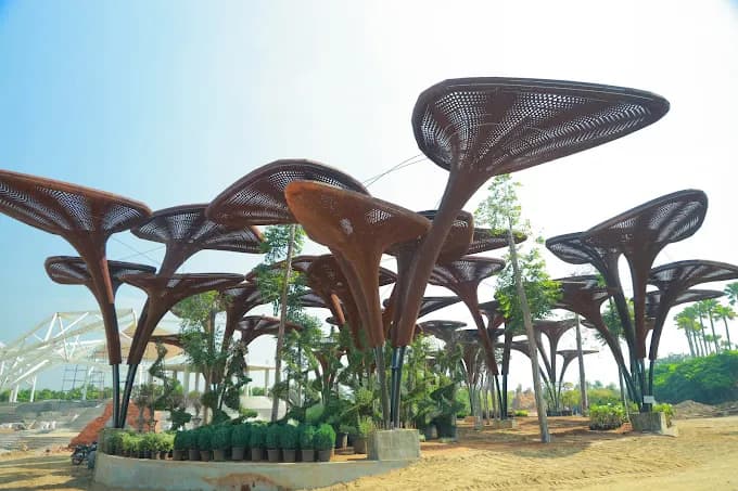 Canopy structures shaped like large mushrooms in a park