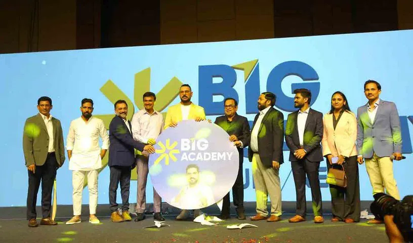 Group posed on a stage at a brand launch